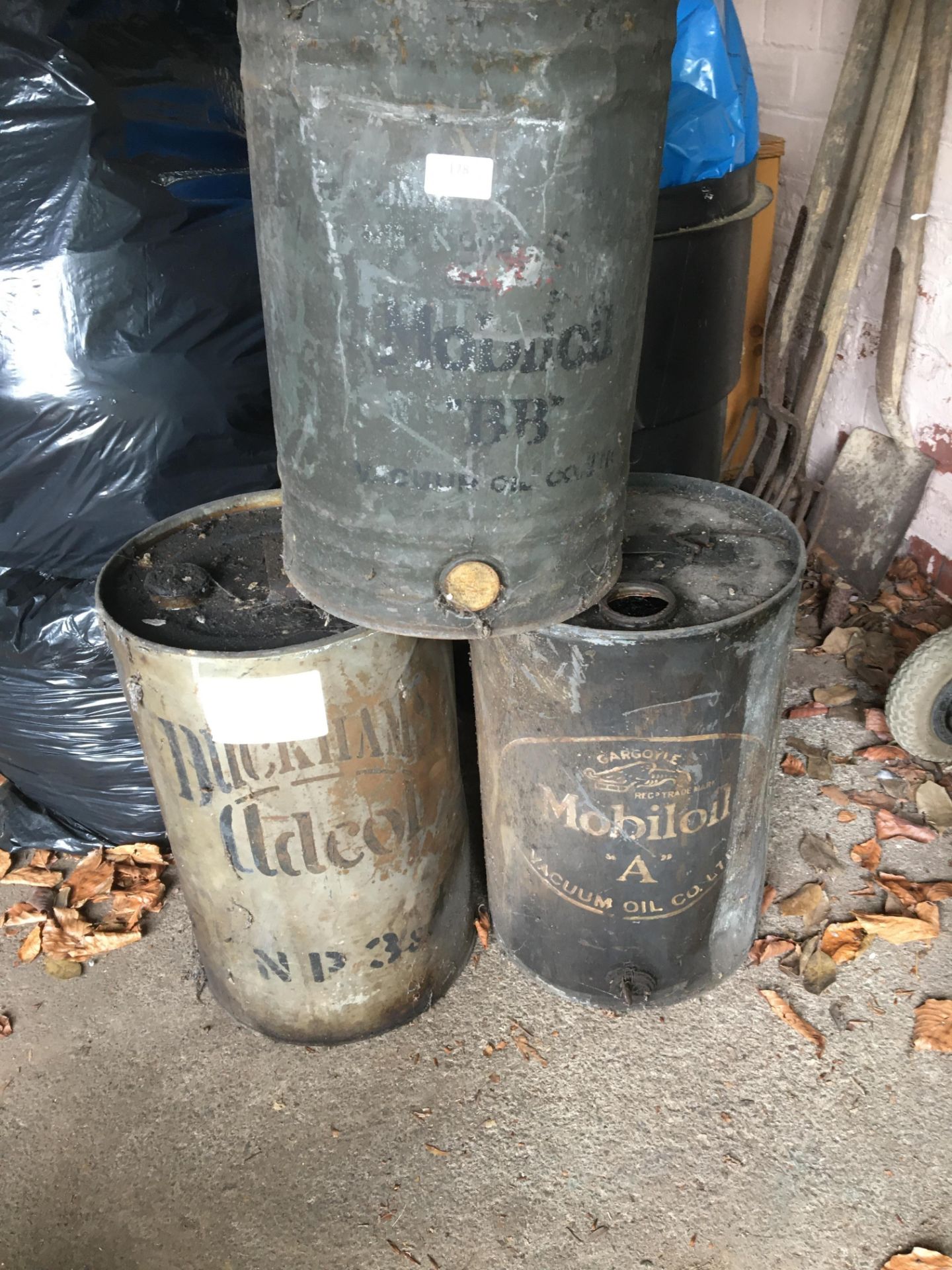 Three Antique Oil Drums; Duckhams, Gargoyle Mobiloil A, and Mobiloil BB
