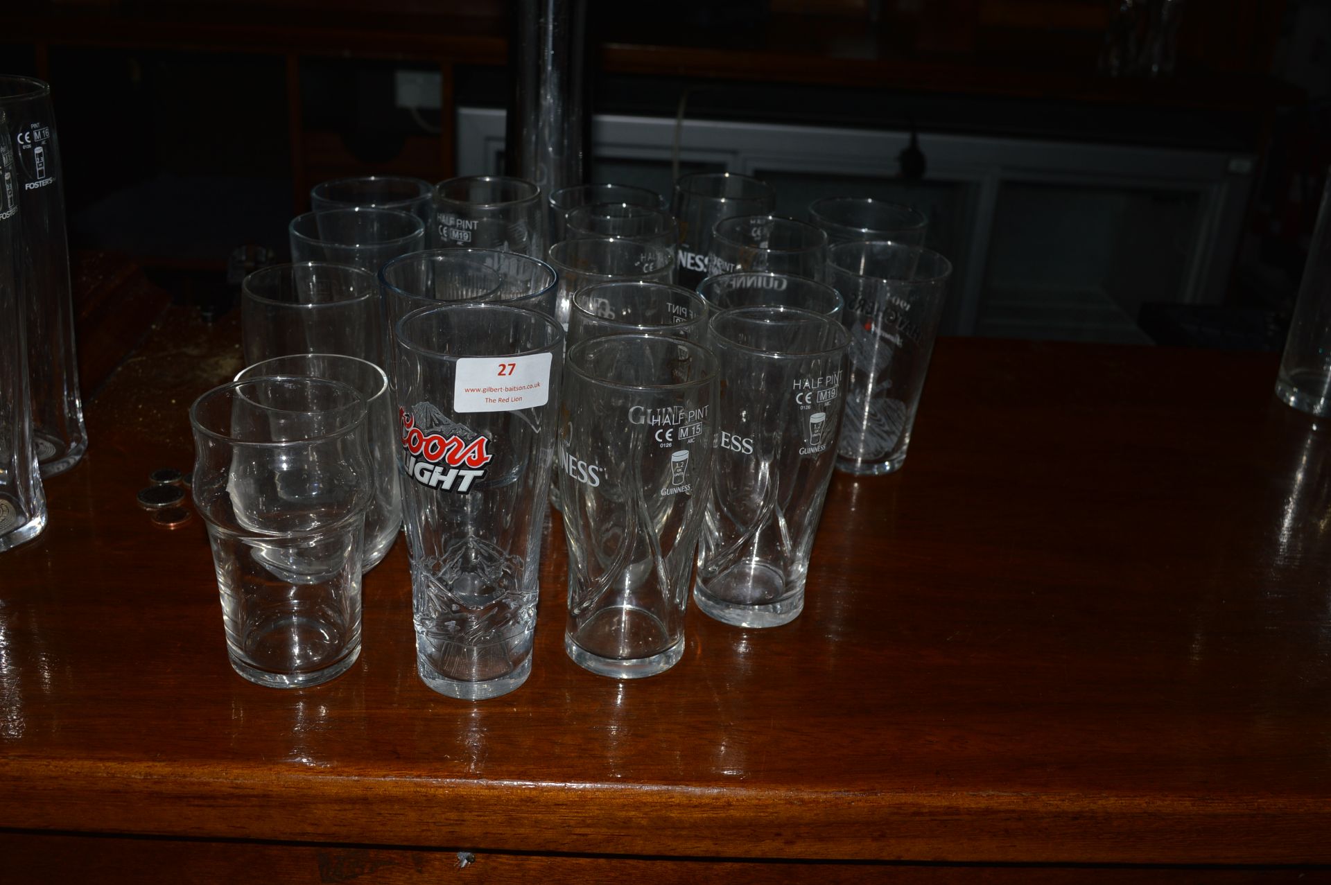 Twenty-Seven Assorted Branded Half Pint Glasses