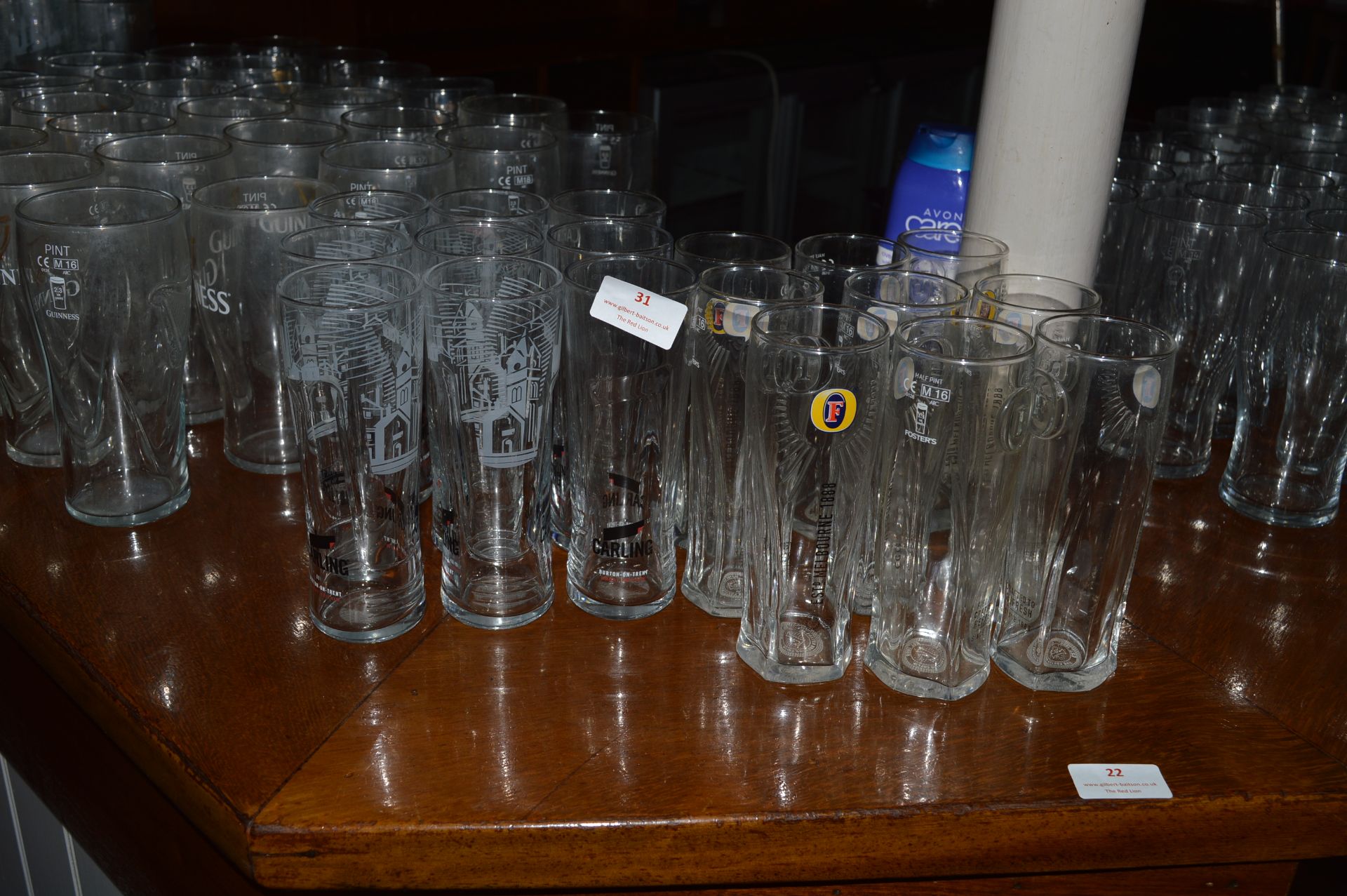 Nine Carling and Nine Fosters Half Pint Glasses