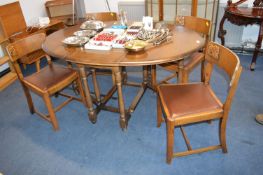 1930's Oak Oval Extending Dining Table and Four Matching Dining Chairs