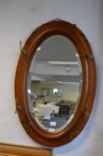 Antique Oak Framed Beveled Edge Oval Mirror with Brass Coat Hooks