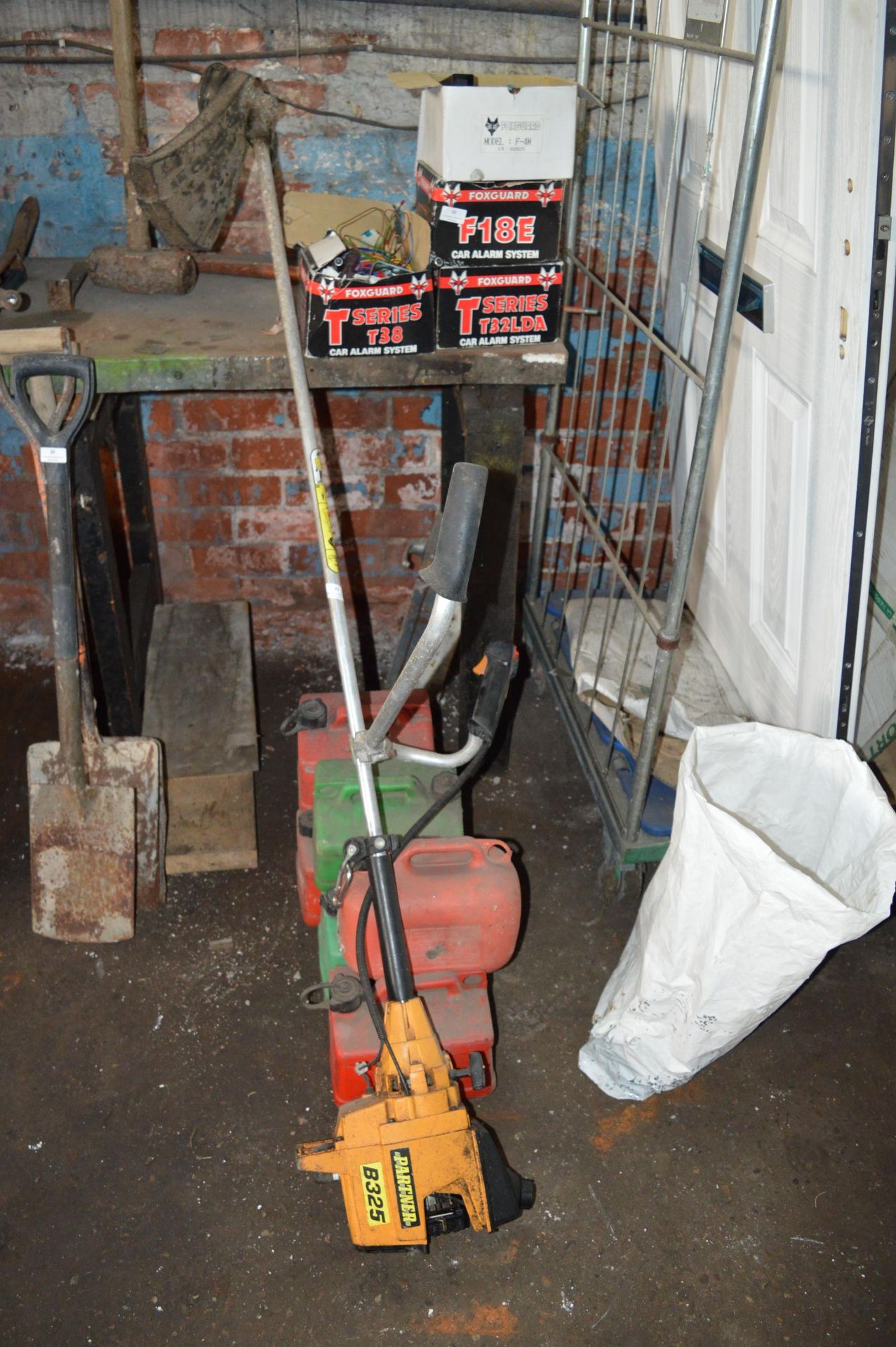 Partner B325 Petrol Strimmer and Fuel Cans