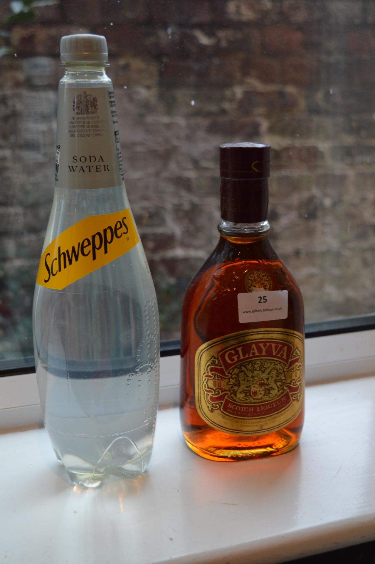 Bottle of Glayva Scotch Liqueur, and a Bottle of Schweppes Soda Water