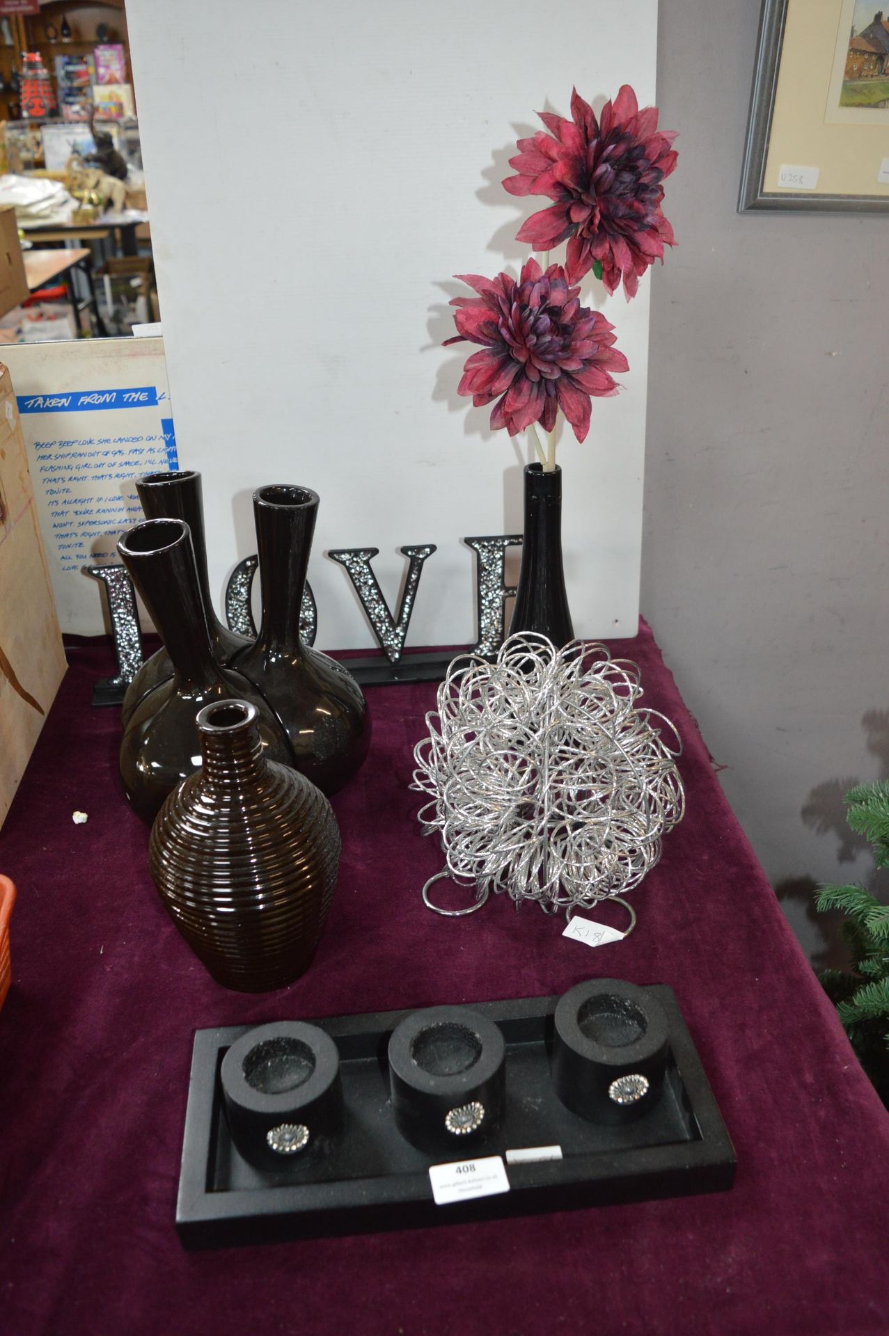 Black Vases, Candle Holders, and a Love Sign