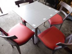 * set of table and 4 chairs, grey wood framed chairs with red upholstered pad, stainless brushed