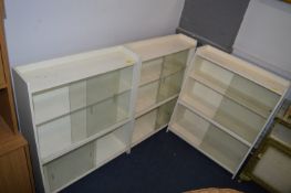 Three White Painted Sliding Bookcases