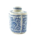 A Chinese blue and white porcelain tea canister and cover, of lobed form, decorated with flowers and