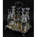 A Victorian silver plated seven bottle cruet, the stand embossed with flowers and foliate scrolls,
