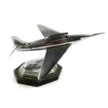 A Gala Sonic 1950's chrome jet aeroplane table lighter, raised on an octagonal base, 23cm W.