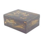 A Japanese Nashiji lacquer box, decorated externally with birds in flight and rolling waves, 13cm