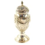 A Victorian loaded silver sugar caster, embossed with ribbon tied swags and acanthus leaves,