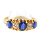 An Edward VII 18ct gold sapphire and diamond fire stone ring, diamonds approx ¼ of a carat, size