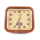 A Rhythm brown plastic cased 1970's transistor clock, rectangular gilt dial bearing Arabic numerals,