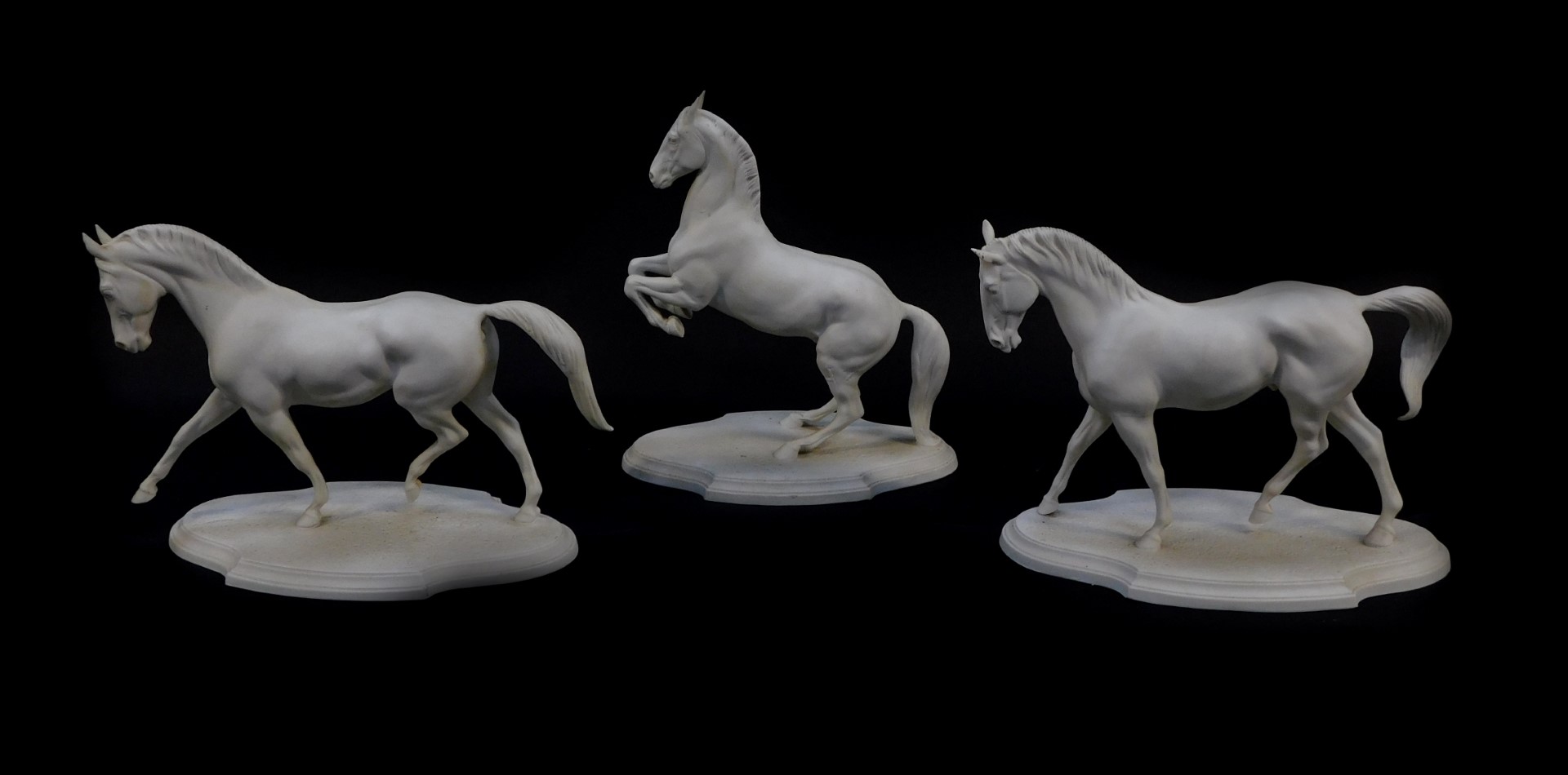 Three Franklin Mint Parian figures of horses, designed by Pamela du Boulay, comprising Extended