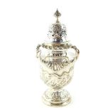 A Victorian silver sugar caster, of baluster form, with embossed foliate decoration, William