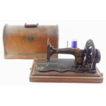 A Singer late 19thC model 12 sewing machine, serial number 7639637/1902237, cased.