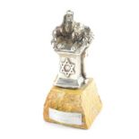 Isiah Aac Yeheskel. A silver sculpture of a Rabbi and pupil reading from the Tanakh, raised on a