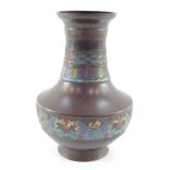 A Chinese Qing Dynasty bronze vase, with bands of cloisonne decoration, pierced for conversion