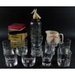 A Schweppes soda syphon, Wade Famous Grouse Scotch Whisky water jug, advertising whisky glasses