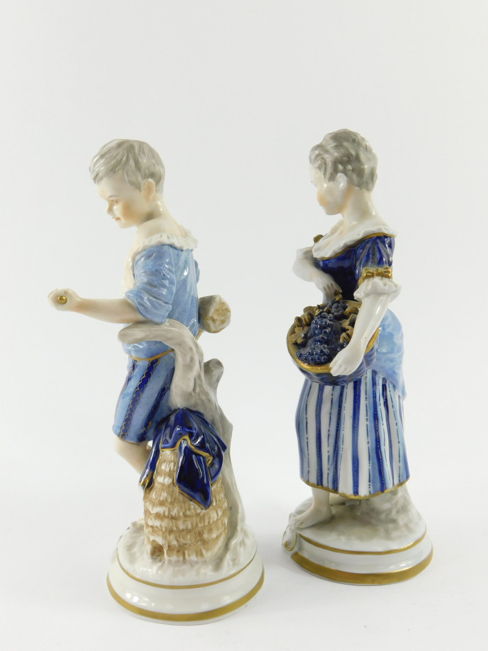 A pair of Unterweissbach 20thC porcelain figures, of a boy and girl, modelled standing with a sheath - Image 4 of 5