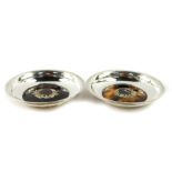 A pair of George V silver and tortoiseshell dishes, pique decorated with garlands of flowers,