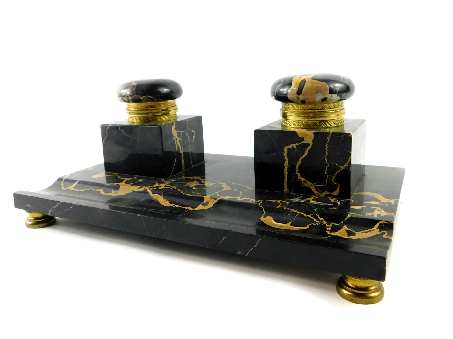 A French late 19thC veined black marble desk stand, with a pair of square integral inkwells with