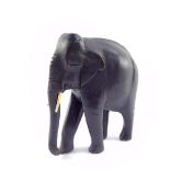 A carved ebony figure of an Indian elephant, in standing pose, 25.5cm high.