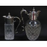 A silver plate and cut glass claret jug, with scroll handle and mask head spout, 25cxm high, and a