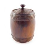 A Holy Land olive wood cylindrical barrel and cover, decorated with Hebrew script, 11cm high.