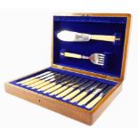 A silver plated fish canteen of cutlery with ivorine handles, cased.