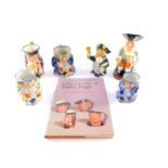 A Royal Doulton pottery character jugs, 19thC and later, comprising of three Toby jugs, a Roy