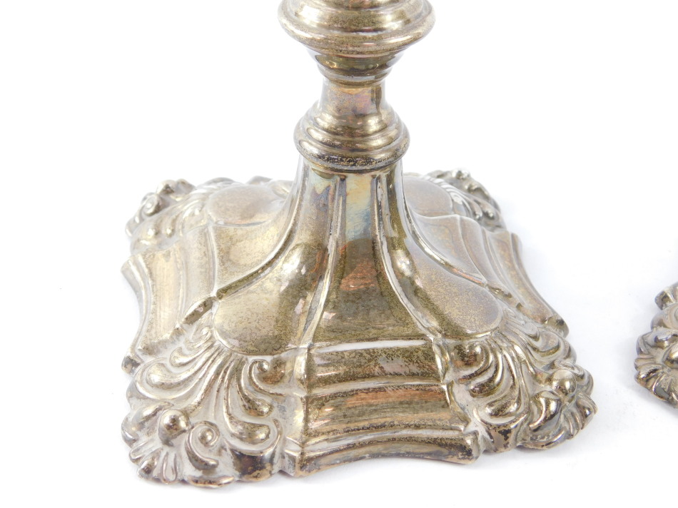 A pair of George III loaded silver candlesticks, of turned form with embossed scroll decoration, - Image 2 of 7