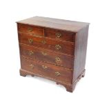 A George III oak chest, of two short over three long graduated drawers, raised on bracket feet, 90cm