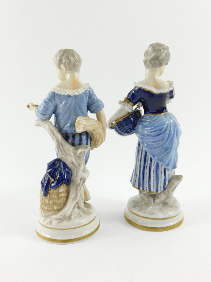 A pair of Unterweissbach 20thC porcelain figures, of a boy and girl, modelled standing with a sheath - Image 3 of 5