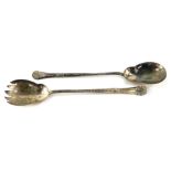 A pair of Edward VII silver salad servers, with embossed shell and scrolling leaf decoration, Walker