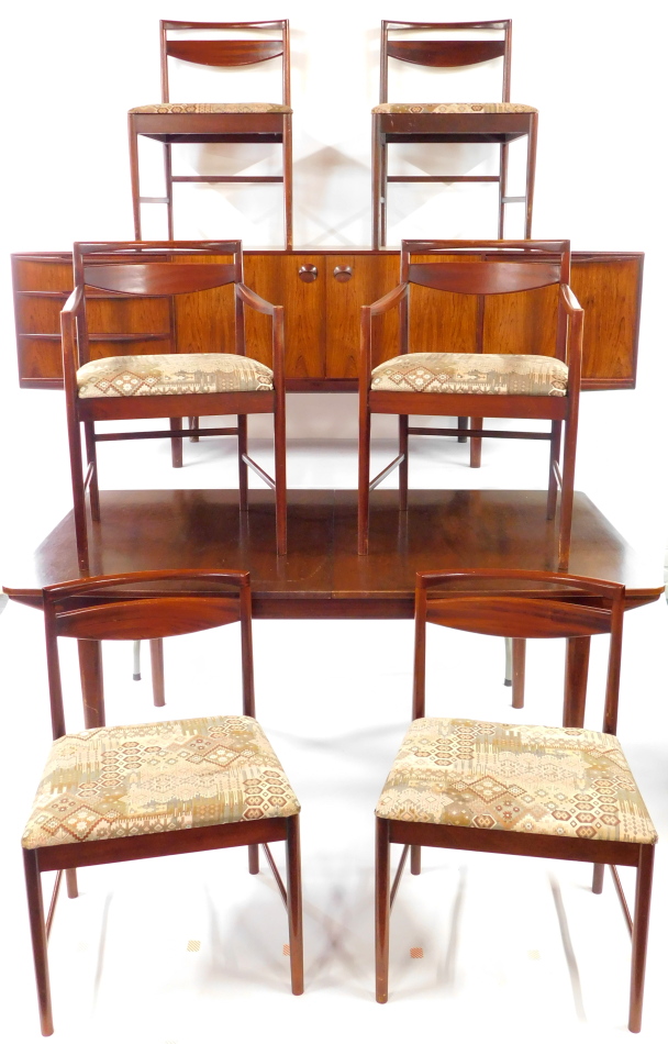 A McIntosh and Co Limited 1960's Rosewood dining suite, comprising a sideboard, with a pair of doors