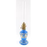 A Gaudard late 19thC blue glass oil lamp, with gilt and white enamel renaissance style decoration,