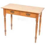 A Victorian pine side table, with two frieze drawers, raised on turned legs, 74cm high, 91cm wide,