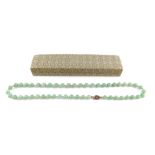 A string of jade beads, on a silver snap clasp, 87g.