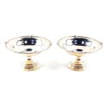 A pair of George V silver sweet meat dishes, of ogee pedestal form, Adie Bros, Birmingham 1924, 5.