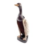 A mid century plastic duck clothes brush and stand, 28cm high.