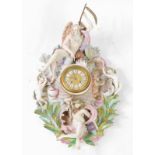 A Meissen style19thC porcelain wall clock, circular embossed brass dial with Roman enamel