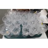 A part suite of cut table glassware, including red and white wine glasses, whiskey tumblers and