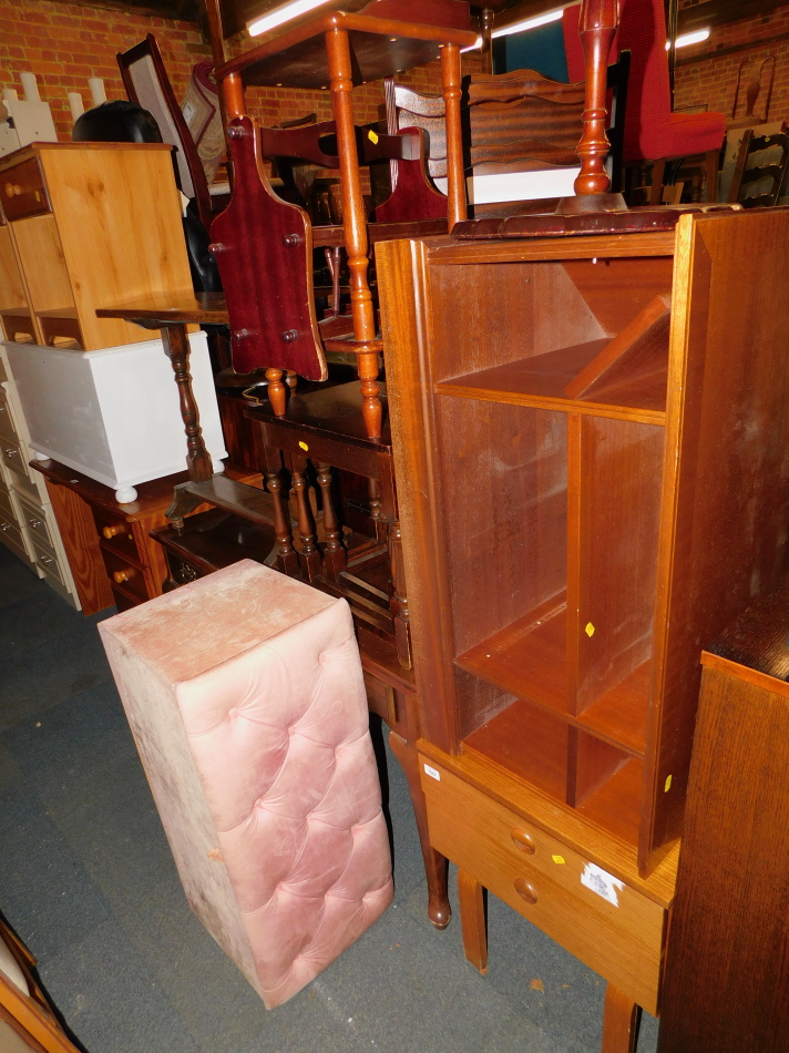 A Schreiber bedside chest, television stand, tables, magazine rack and an ottoman. (7)