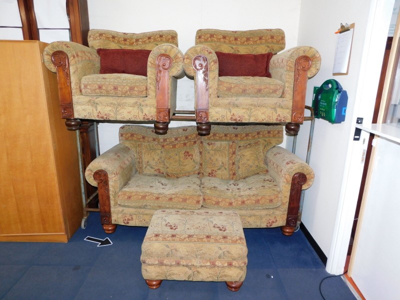 A Showframe two seater sofa, decorated in an elephant pattern fabric, with scatter cushions, 190cm