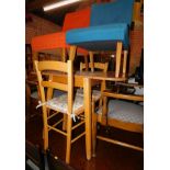 A 1950's Formica drop leaf table, 75cm high, 106cm wide, 60cm deep., together with two rush seated