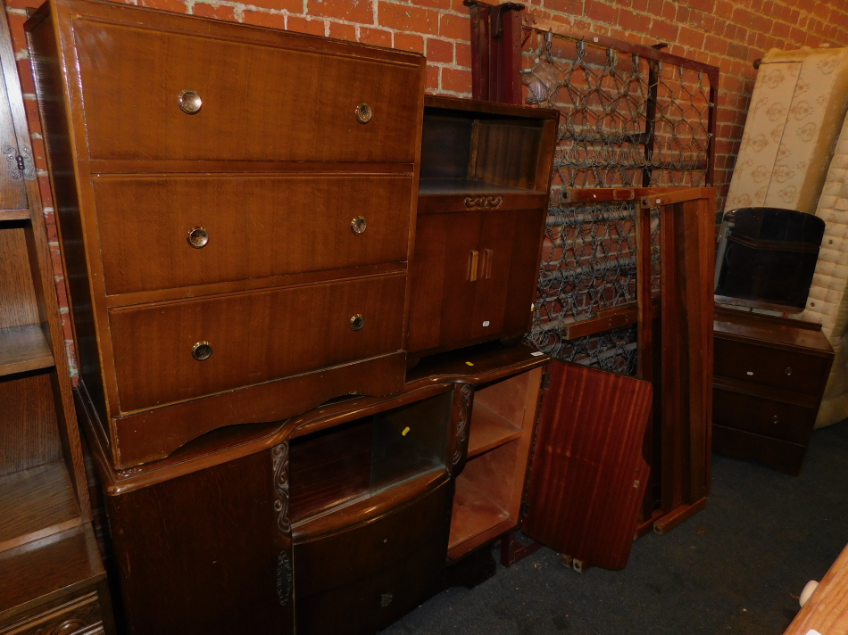 An oak sideboard, two chests of drawers, an oak two door cabinet, a single bed frame and a double