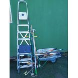 A wheelbarrow and contents of garden hand tools, together with step ladder, and further garden