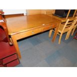 An oak and oak veneered Abbess style two drawer desk, 76cm high, 121cm wide, 76cm deep.