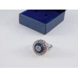 A white and blue paste set circular dress ring, size L, boxed.